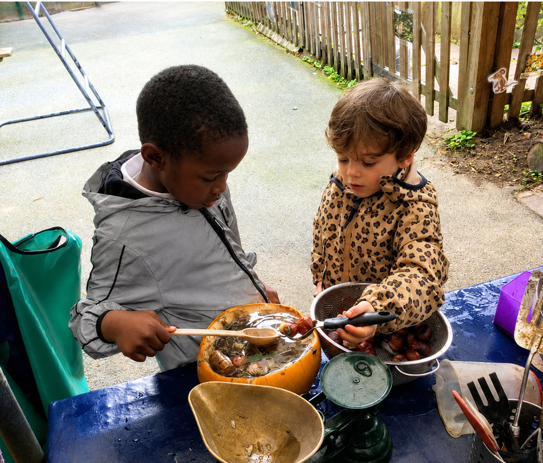 kids-playing-in-mud-kitchen Kids playing in mud kitchen